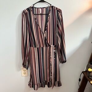 A long sleeve, 70s style mid length dress in size medium by xhilaration